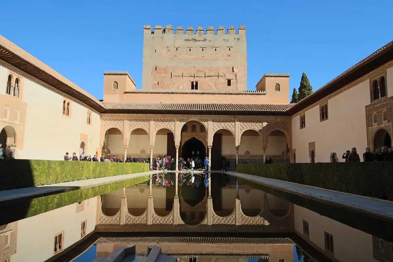 The Court of the Myrtles and its long pool, with the Comares Tower