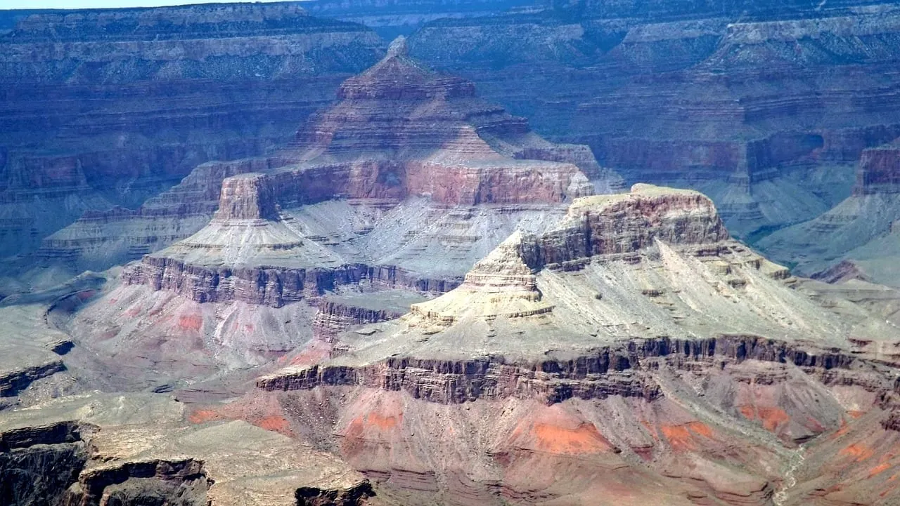 Banded red and white rock formations inside the canyon