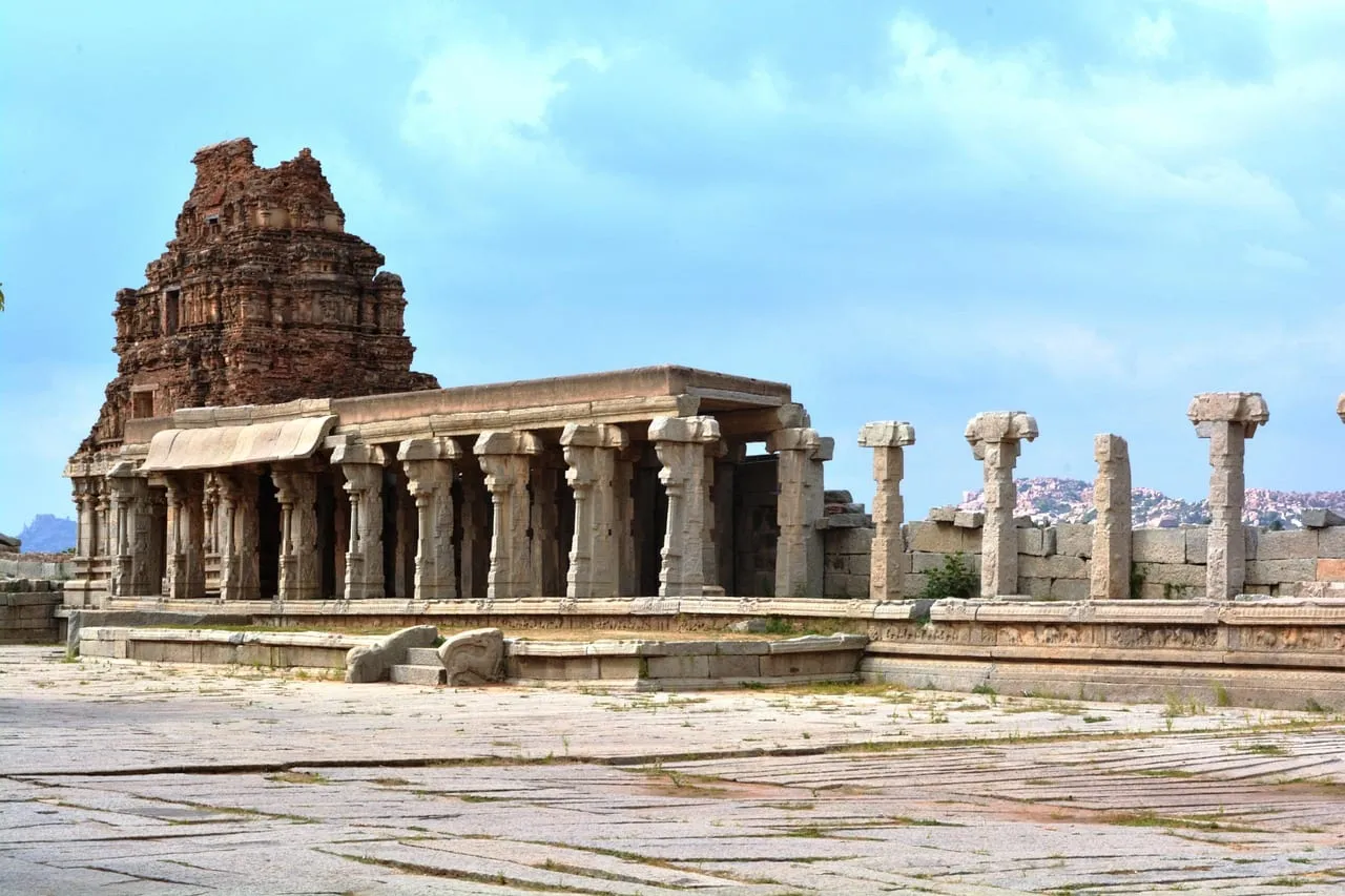 A pillared hall and temple tower in the Vittala complex