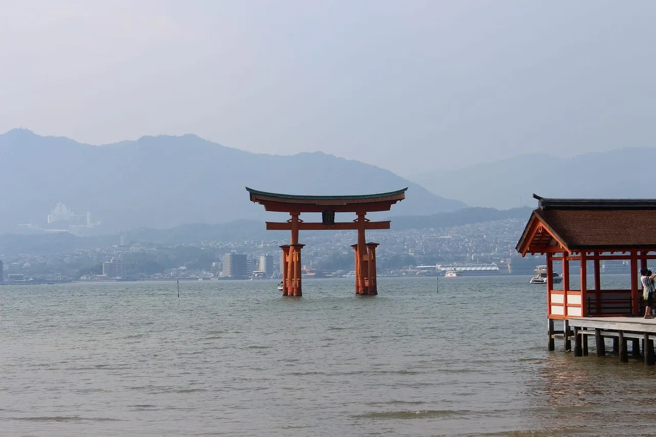 The torii seen from a shrine walkway over the water