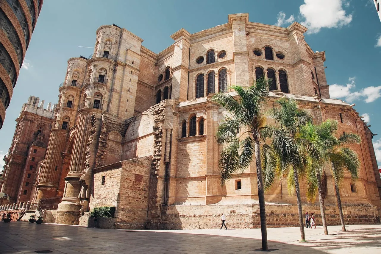 The cathedral’s unfinished south tower and its palm-lined square