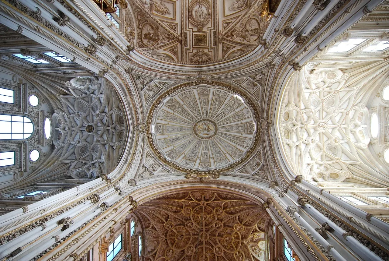 The carved white vaults of the cathedral built inside the mosque