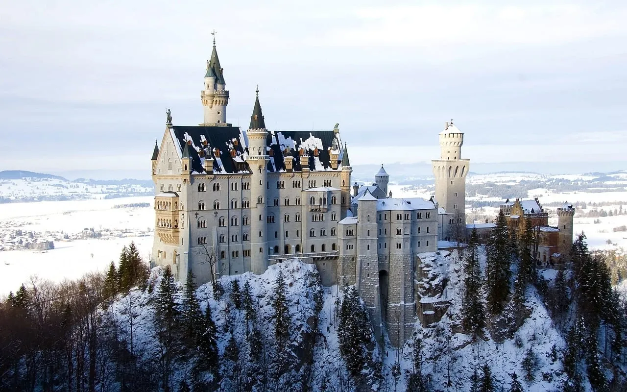 Neuschwanstein Castle in winter, with snow on the hillside