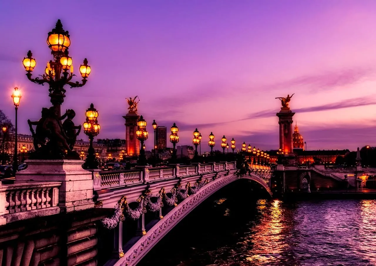 The Pont Alexandre III and its gilded lamps over the Seine at dusk