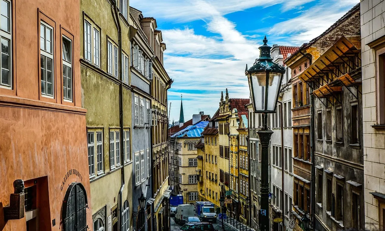 A narrow street of old houses and a lamp in Prague’s Old Town